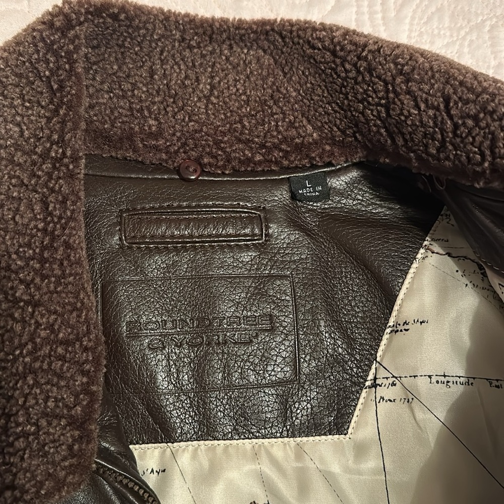 Brand new, never worn leather bomber jacket w/faux fur removable collar.